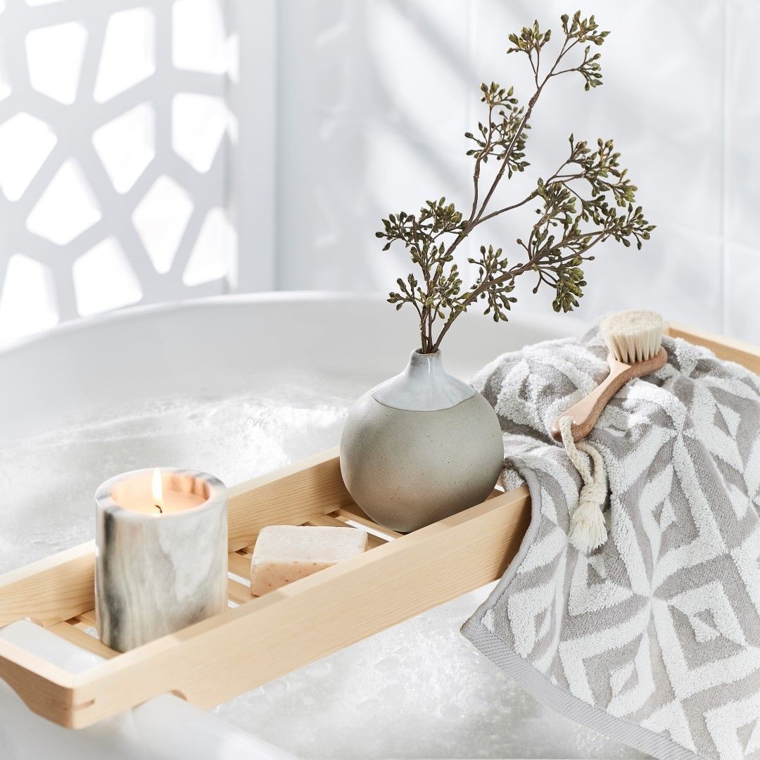 bed bath and table towel styling on bath caddy