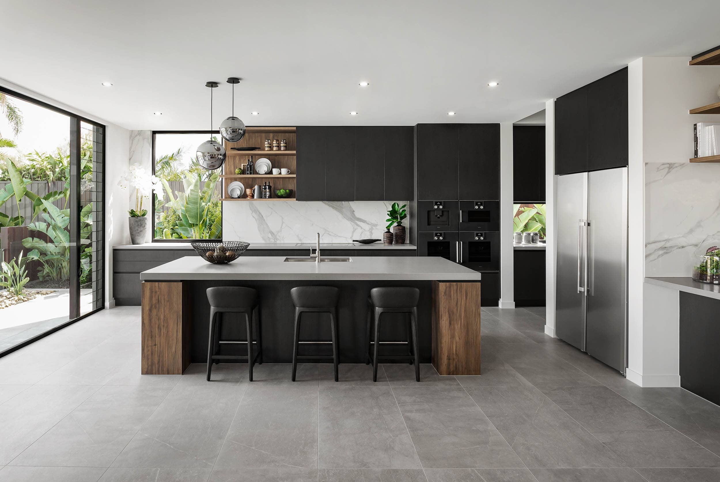 black and brown modern industrial kitchen design with grey floor tiles