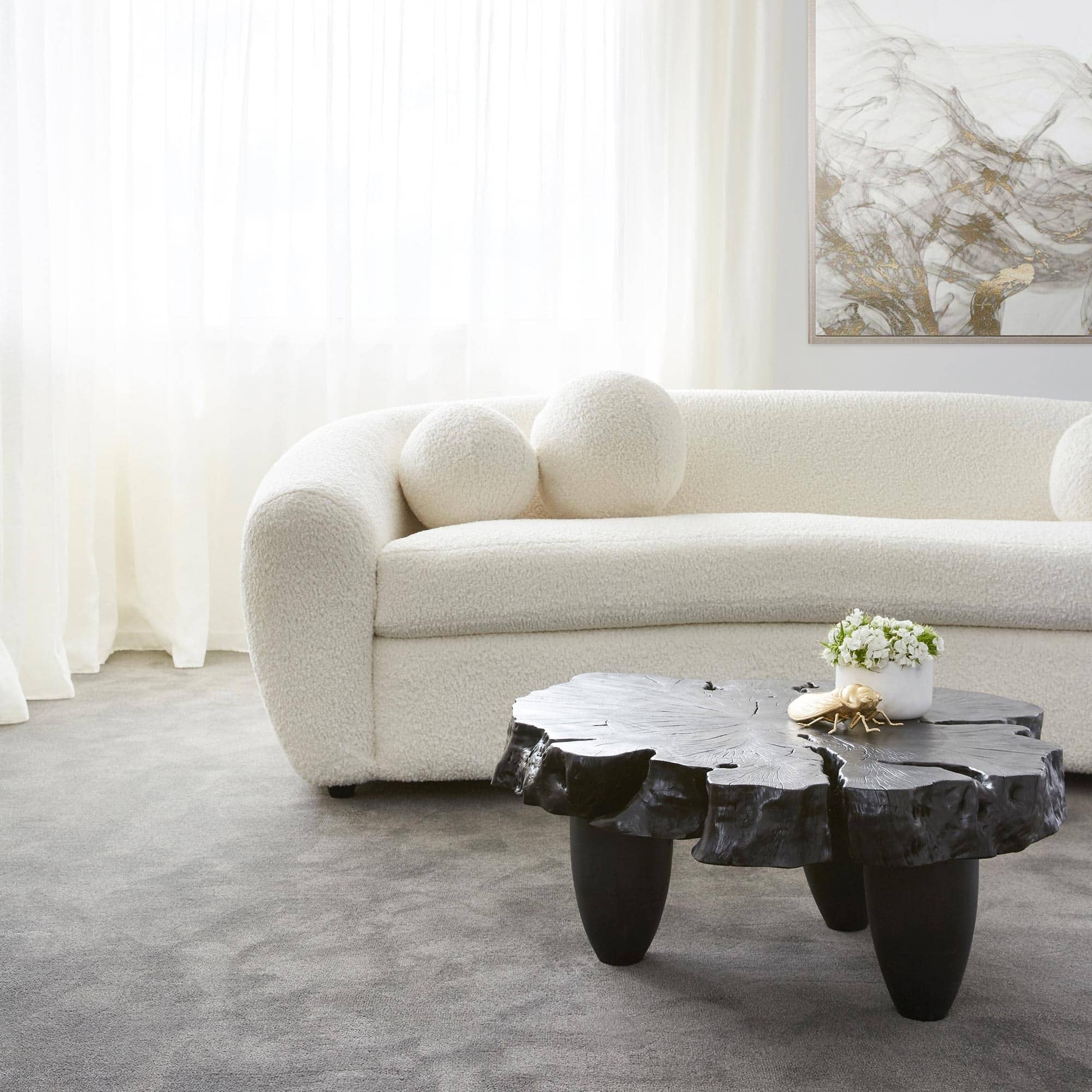 black organic coffee table coco republic white boucle sofa luxe living room