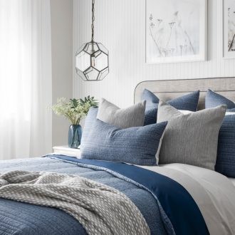blue and white hamptons bedroom design with grey headboard and industrial pendant lightsblue and white hamptons bedroom design with grey headboard and industrial pendant lights