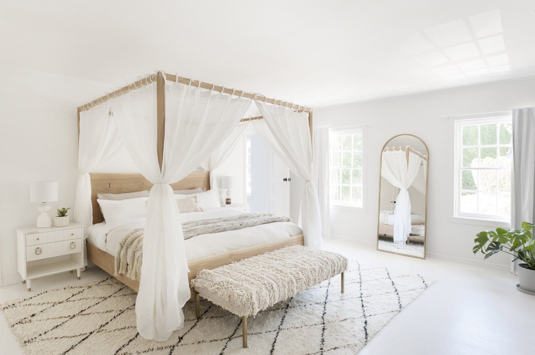 bohemian bedroom with bodo decor and diamond shag rug four poster bed