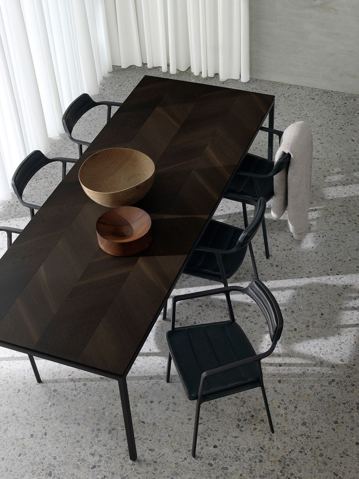 brown rectangle dining table with herringbone top on polished concrete floor cult furniture