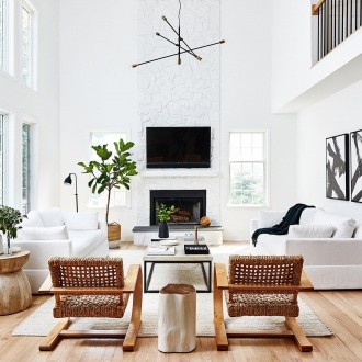 california cool interior design living room with white brick fireplace and mid century pendant