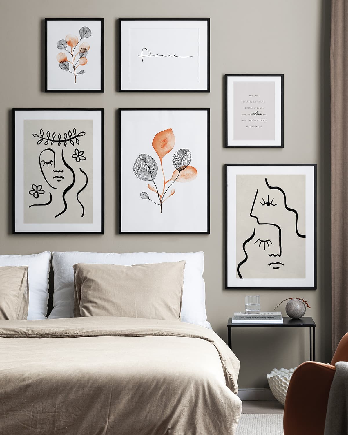 creating a gallery wall in a bedroom black and white artworks on bedroom wall