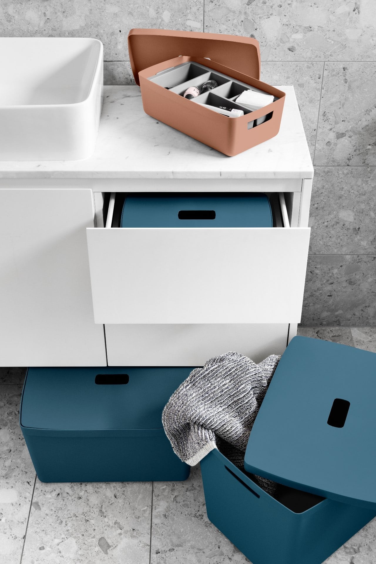 desert clay and cactus blue inabox storage containers in bathroom