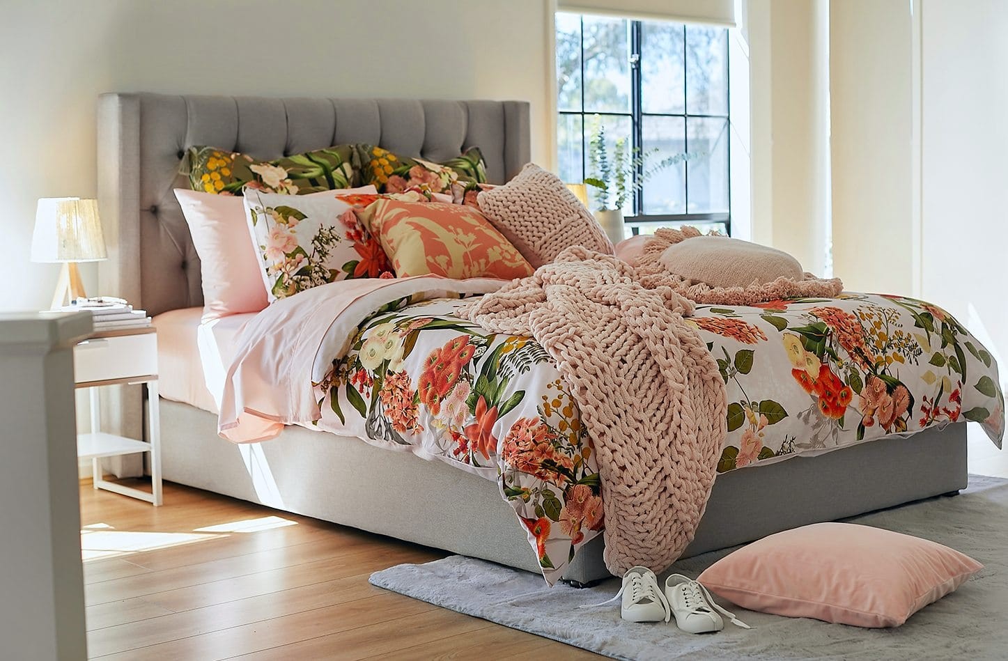 desert tones interior design bedrom with floral quilt cover set and blush sheets