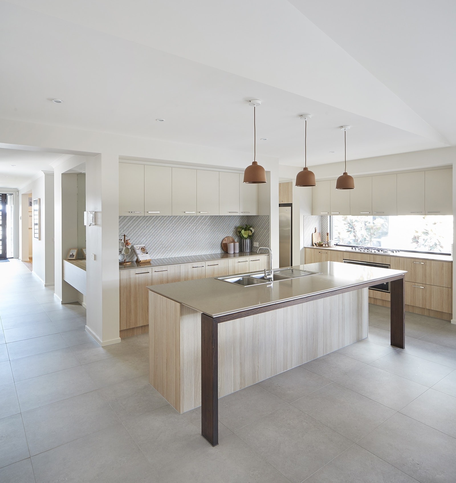 energy efficient home designs kitchen by metricon homes with terracotta pendants