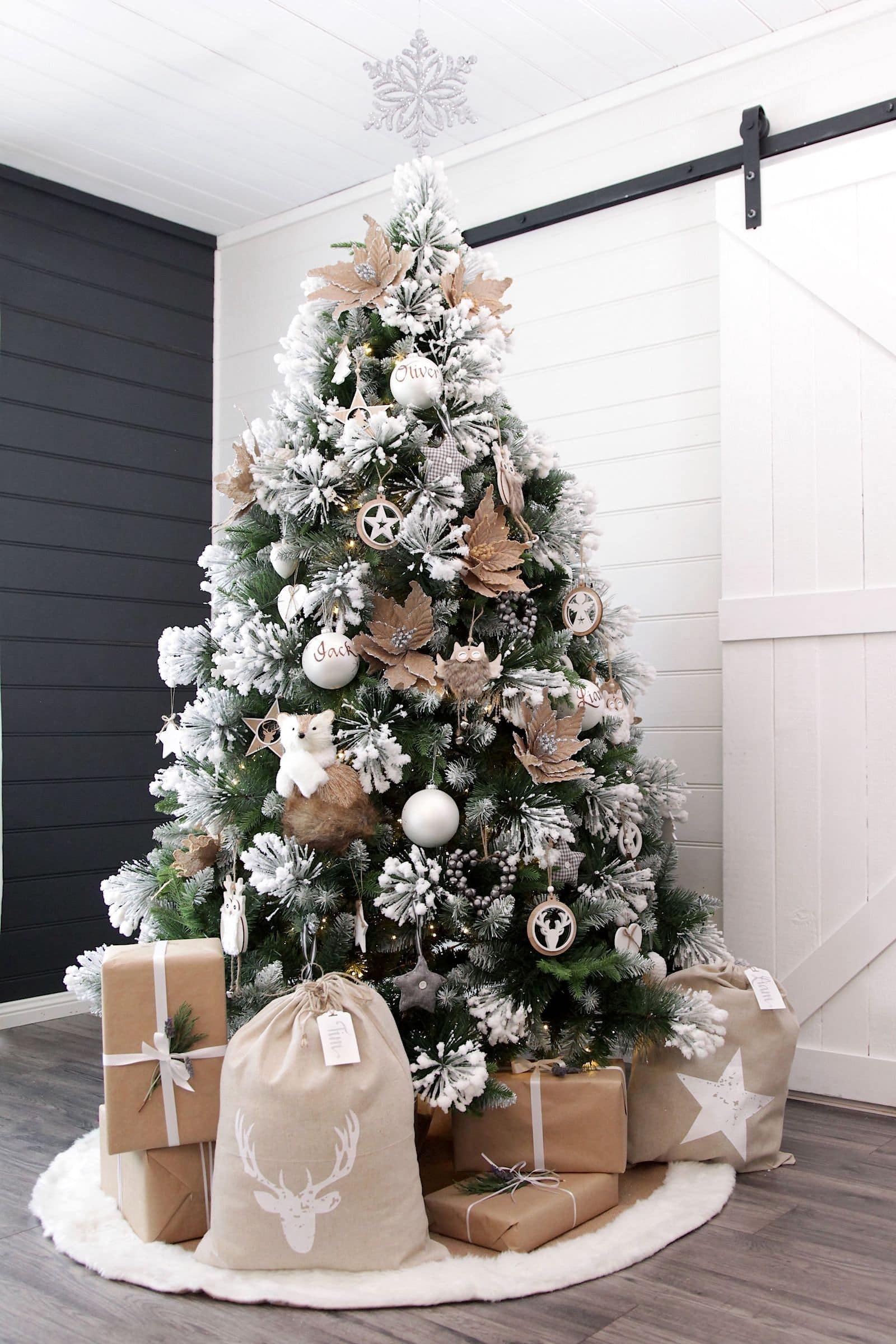 fake christmas tree with snow and white and timber tree decorations