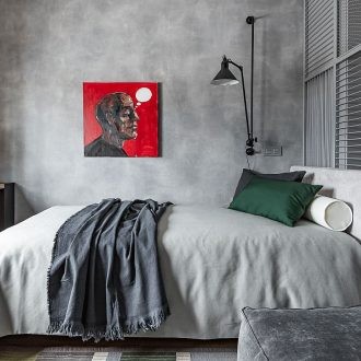 grey industrial bedroom with rustic timber furniture and concrete feature wall