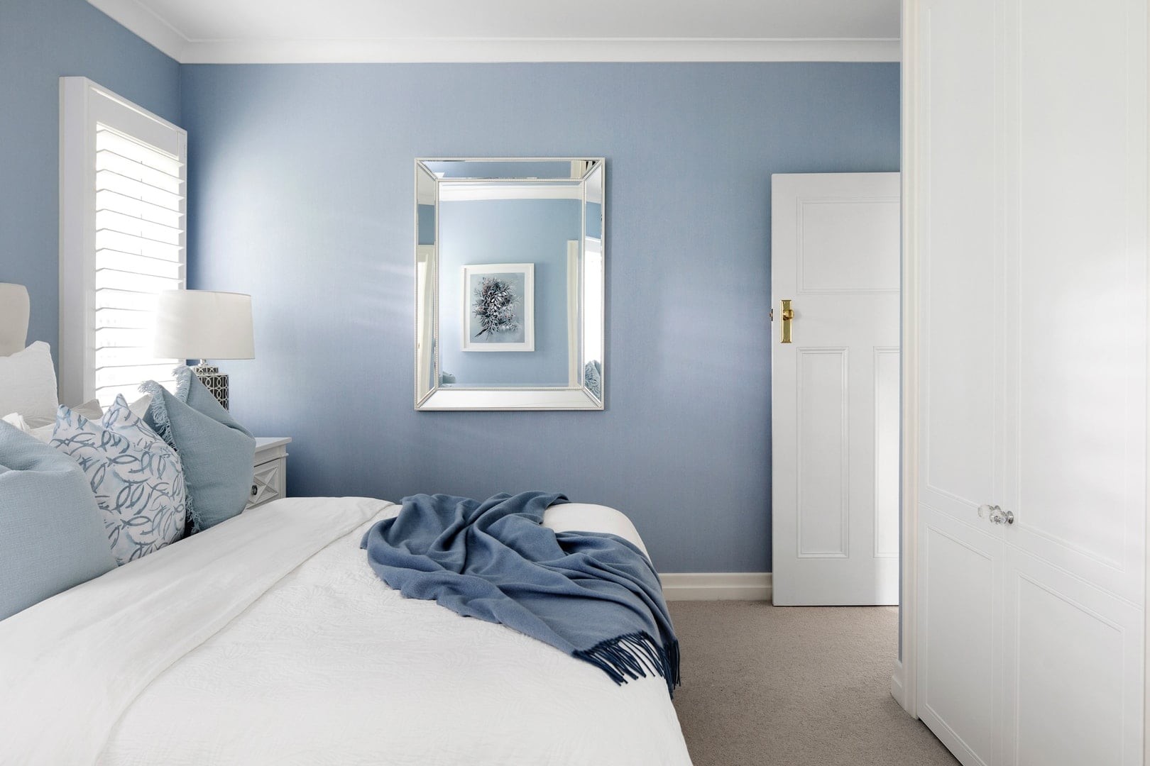 hamptons-bedroom-with-blue-wallpaper-and-white-plantation-shutters
