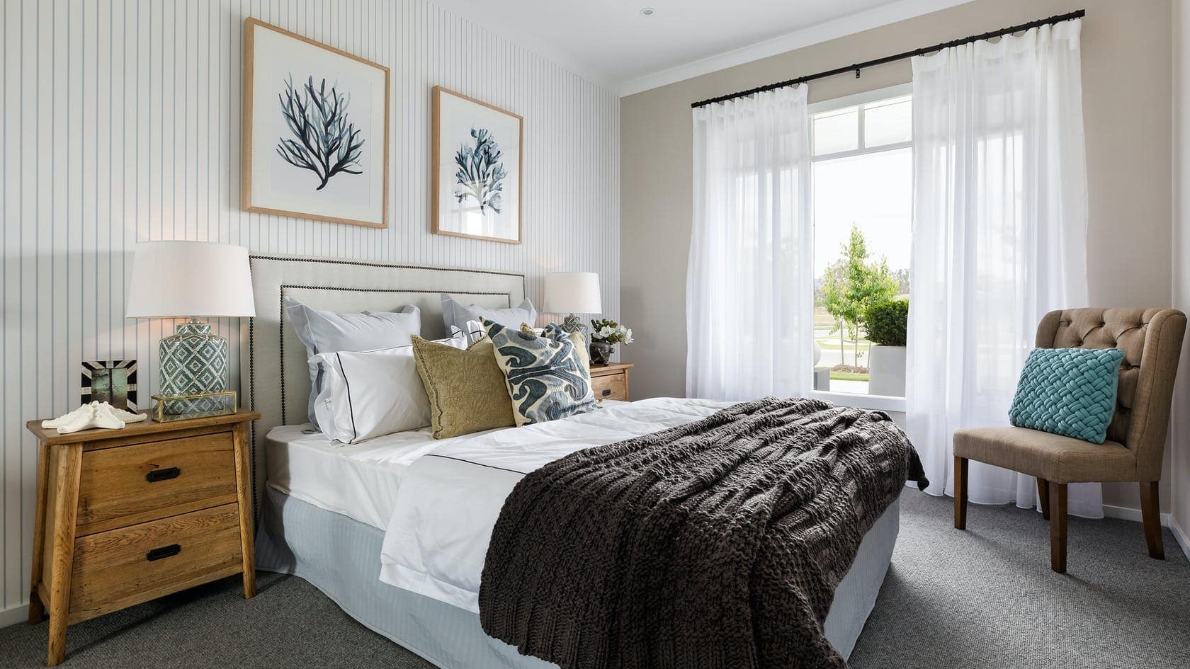 hamptons bedroom with striped wallpaper and white sfold sheer curtain on black track