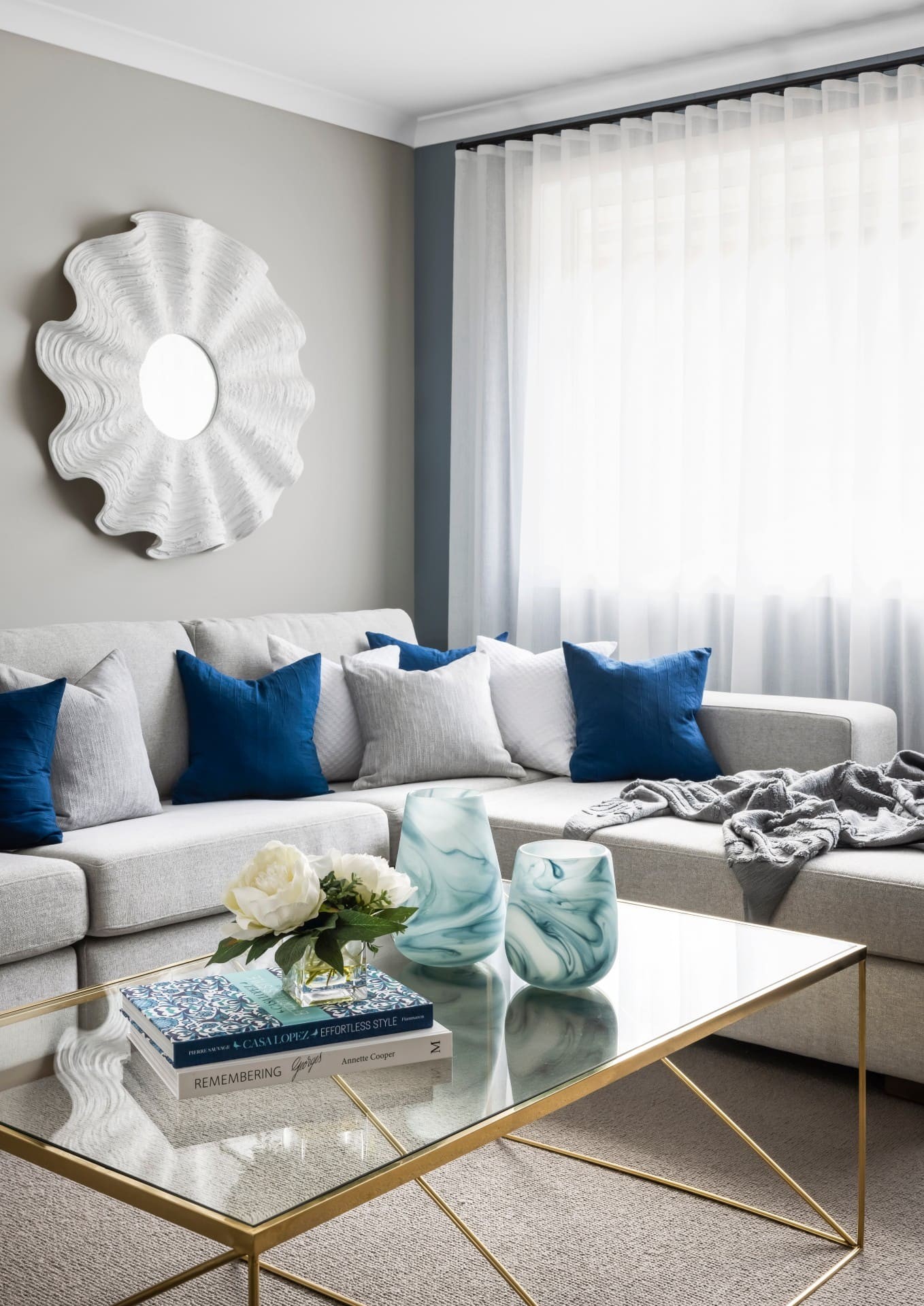 hamptons living room ideas styling with navy and grey cushions on grey sofa