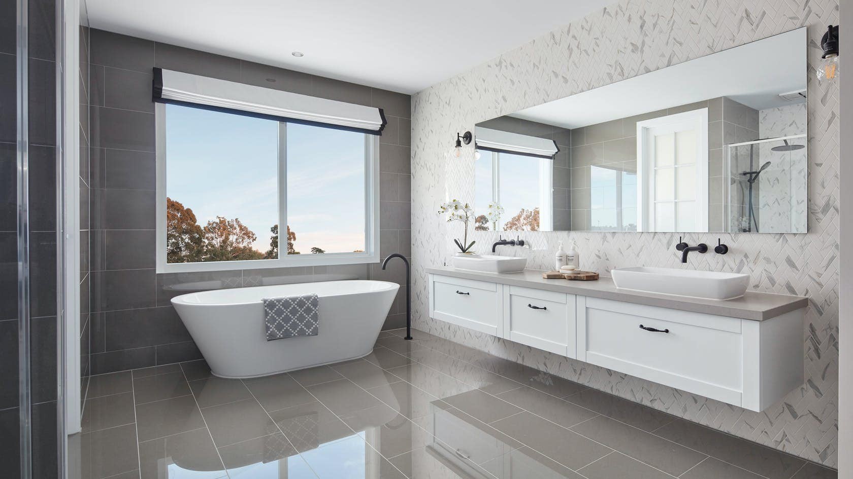 hamptons style bathroom with black and white roman blind on window