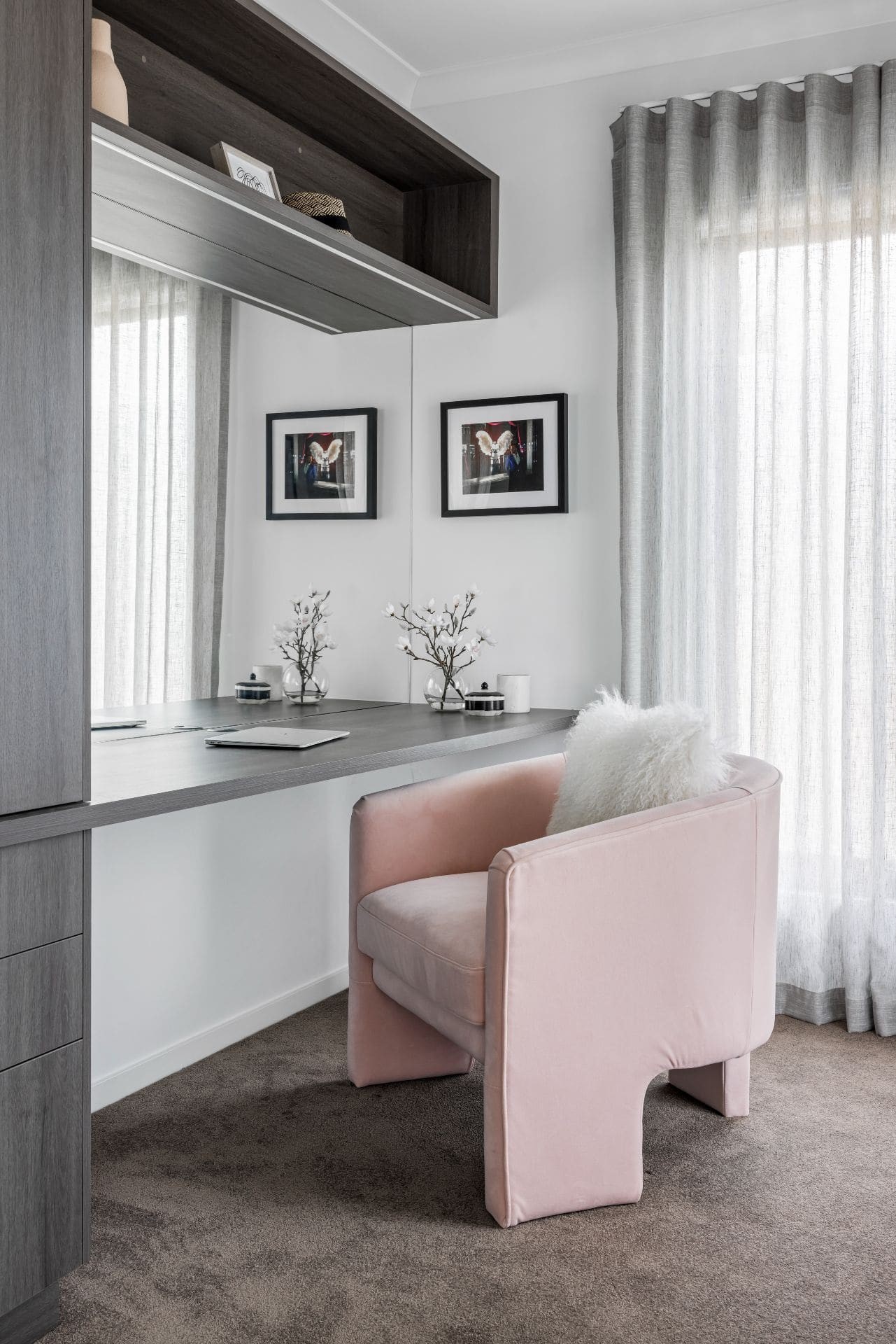 home office with walnut joinery and pink velvet armchair from coco republic