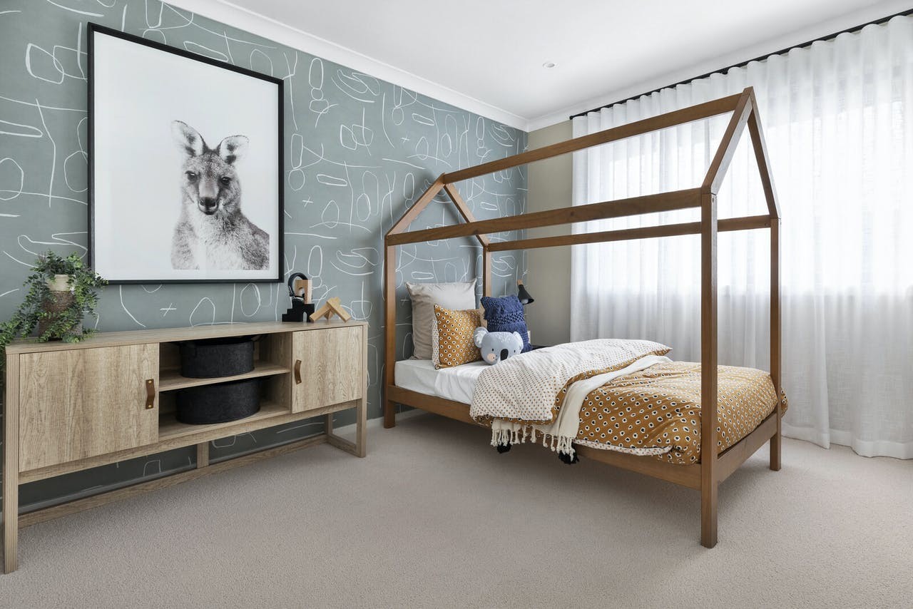kids bedroom styling with four poster house bed timber