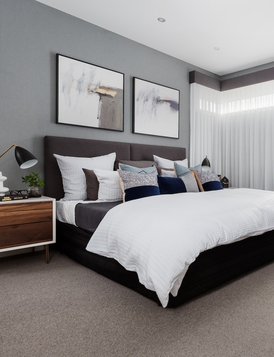 modern master bedroom with grey wallpaper design and white bedding from metricon