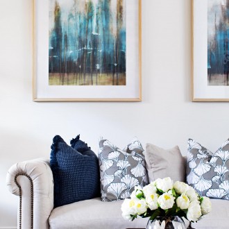 modern provincial living room with beige provincial sofa and blue and white cushions
