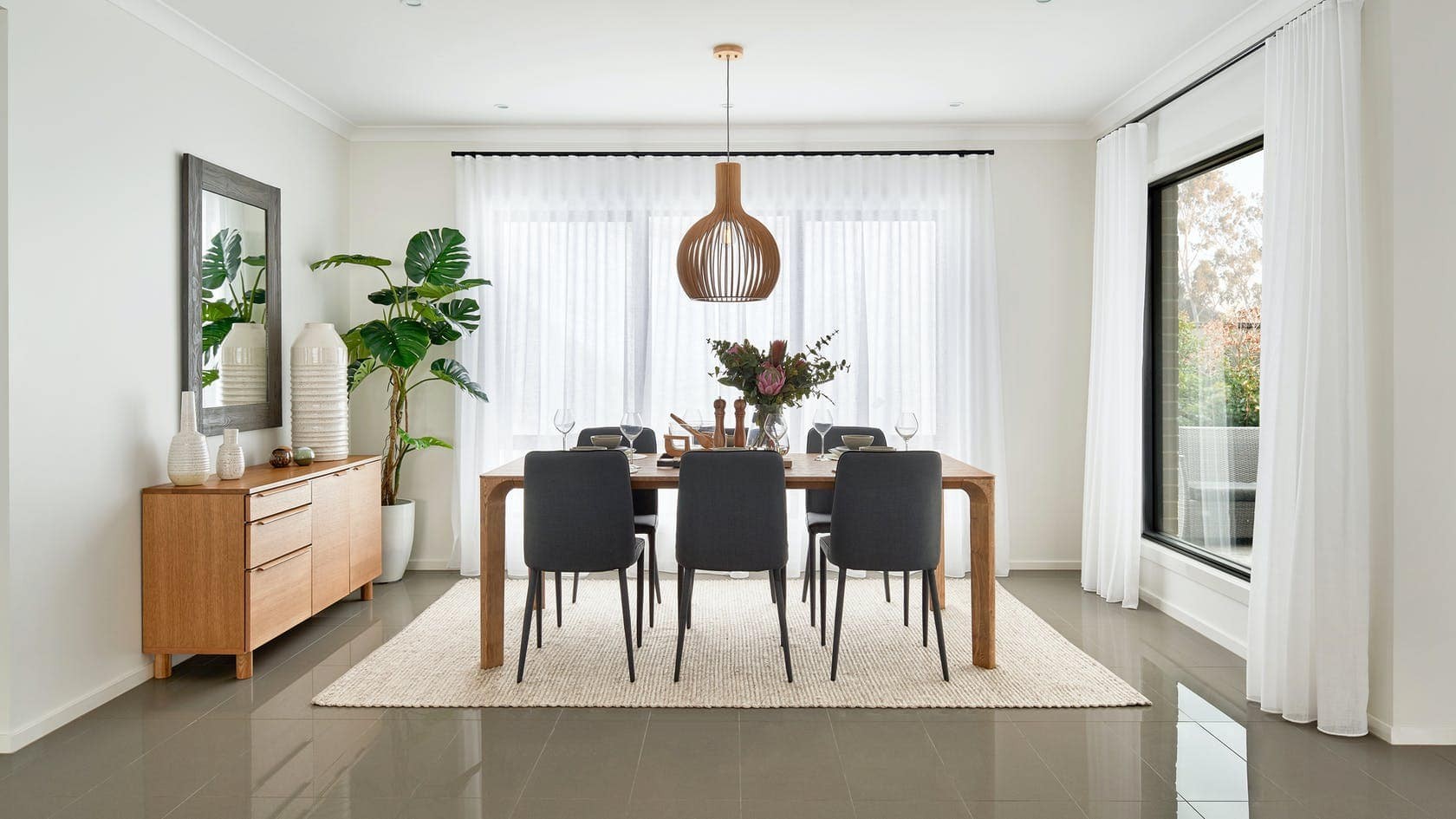 modern white dining room with white s fold sheer curtains on black track