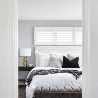 monochromatic master bedroom design with heatherley designs bedhead gold bedside table lamp and plantation shutters