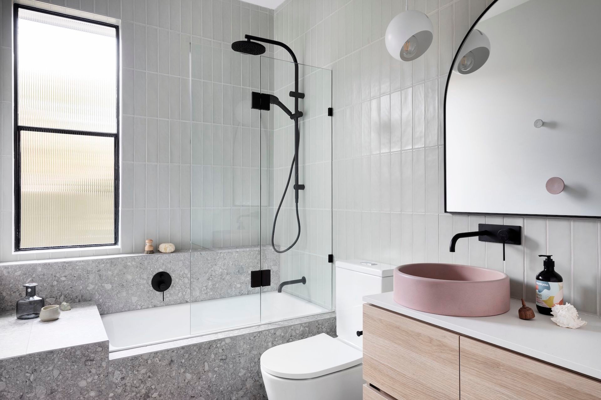 nood co round coloured bathroom basin in chic grey bathroom with black taps