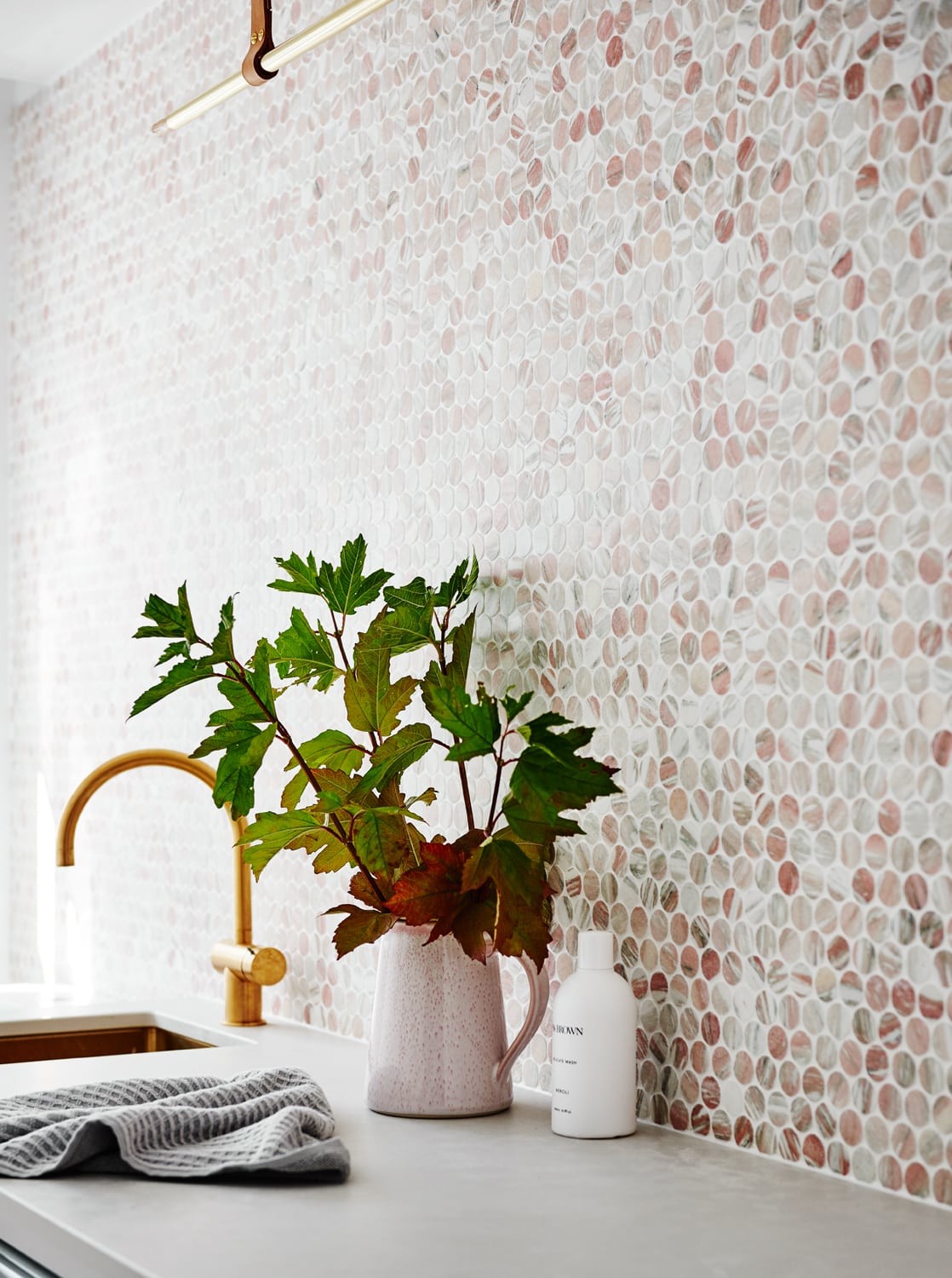 norsu home laundry blush penny round tiles and brass tap