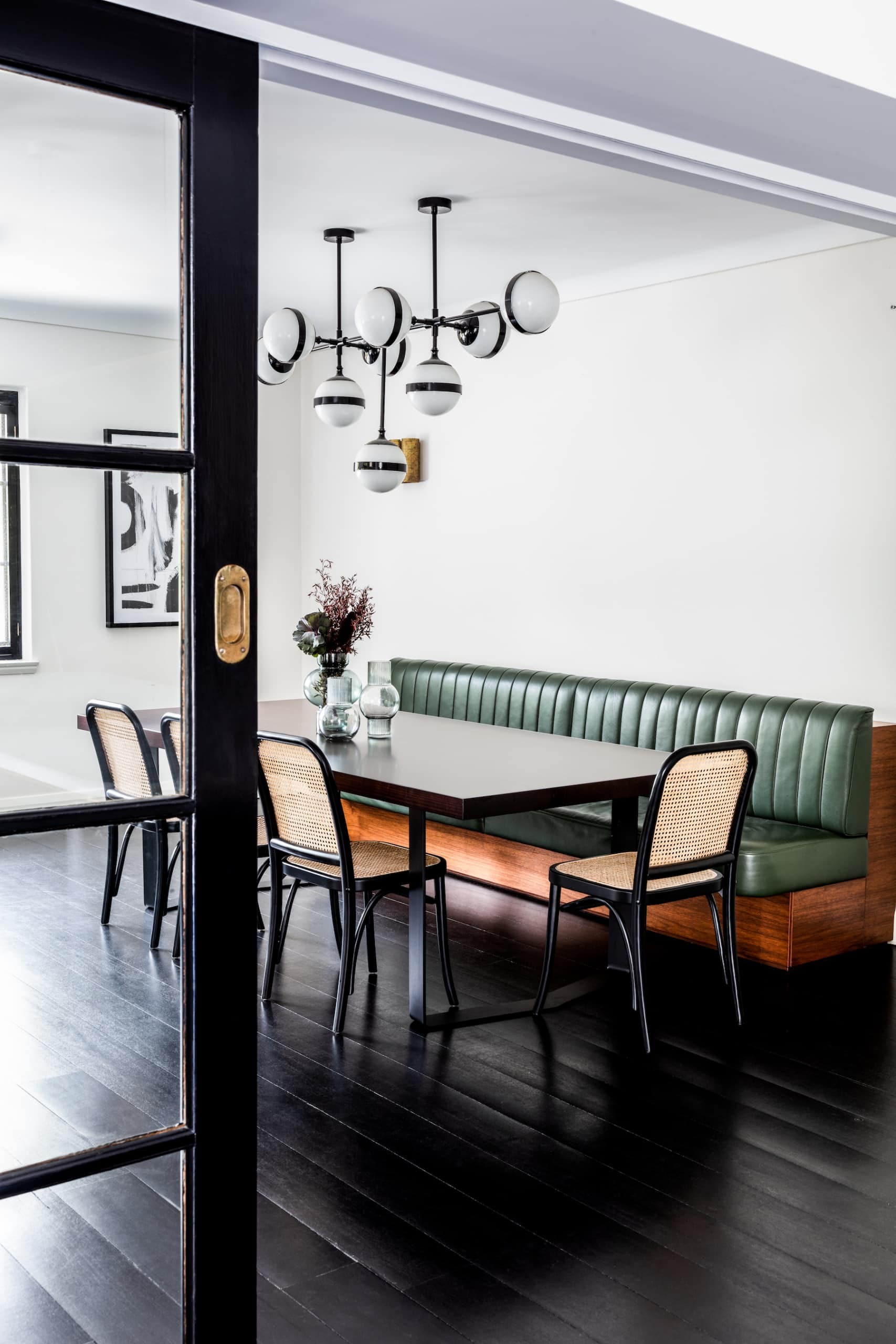 oz design abby dining chairs in chic dining room with leather banquette seating