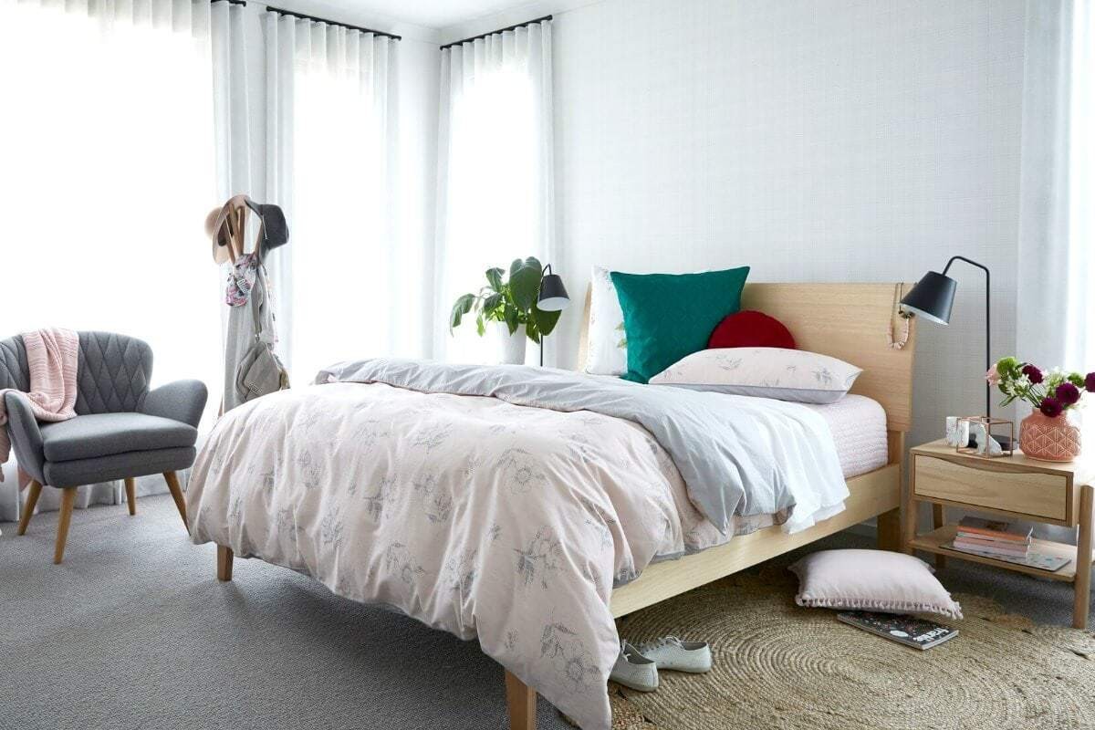 teenage girls bedroom ideas soft pink bedspread on blonde timber bed with pops of green