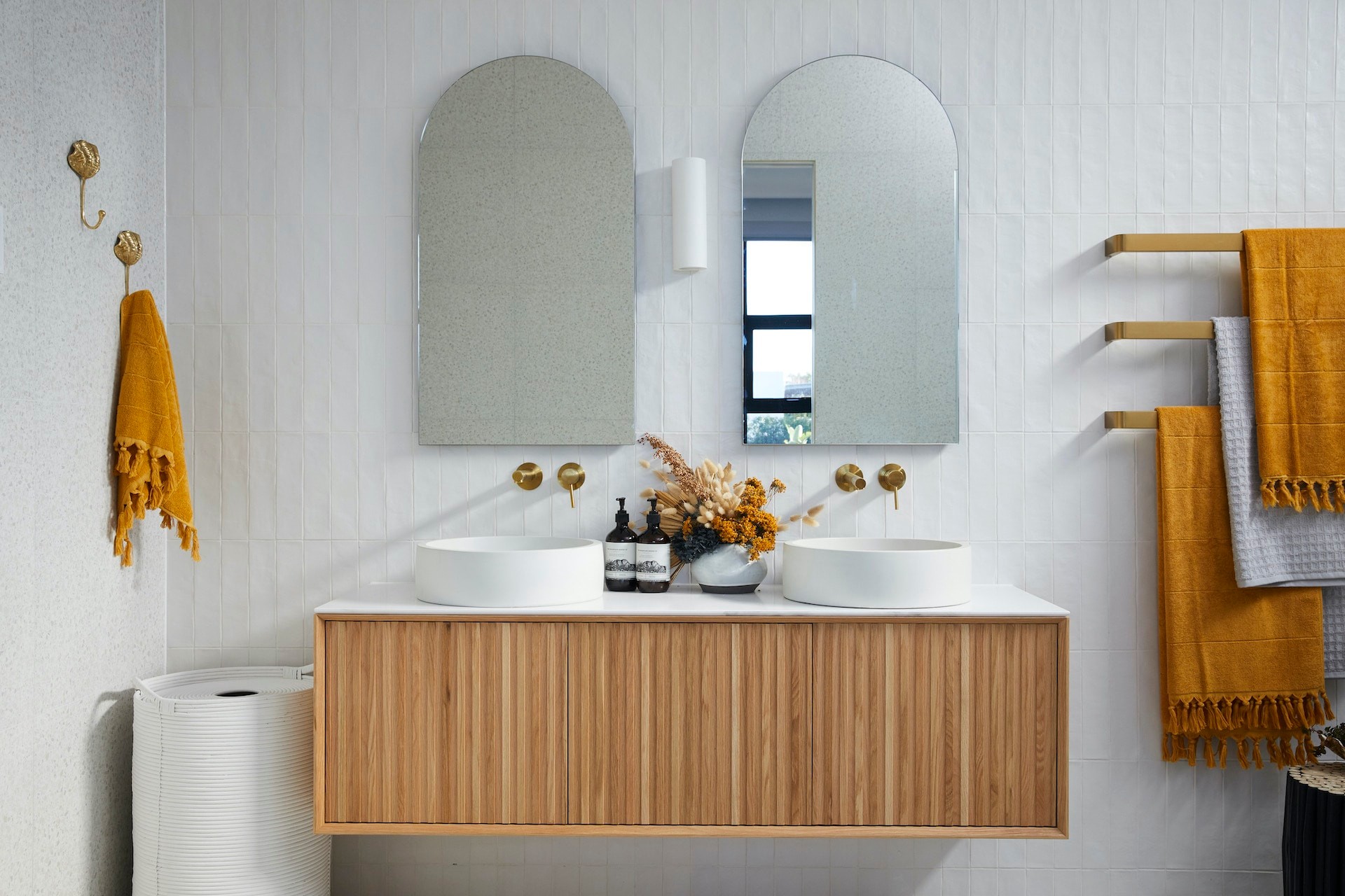 the block 2020 luke and jasmin modern bathroom with arched mirrors and slatted timber floating vanity