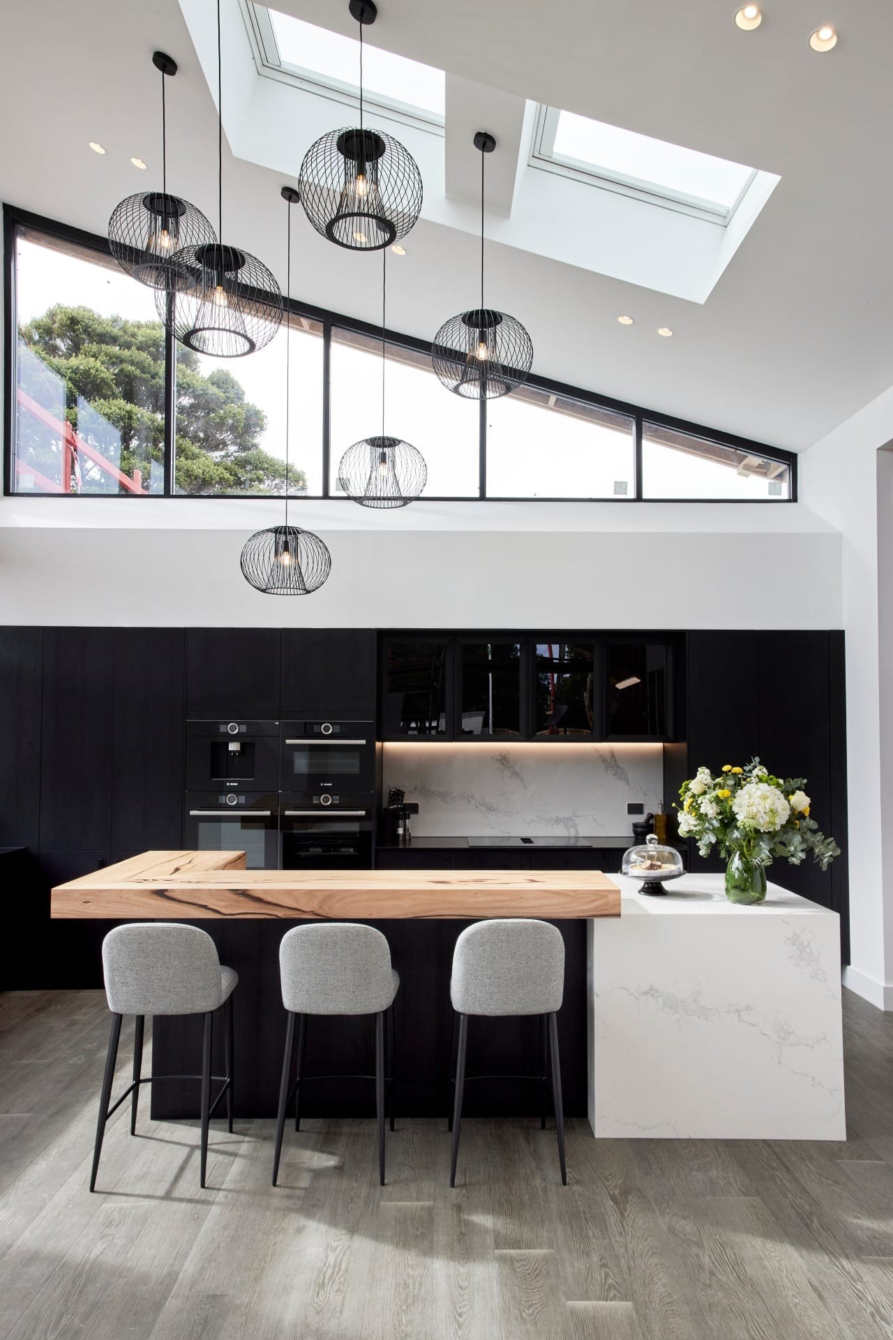 the block 2021 josh and luke black and white kitchen with timber benchtop and vaulted ceiling
