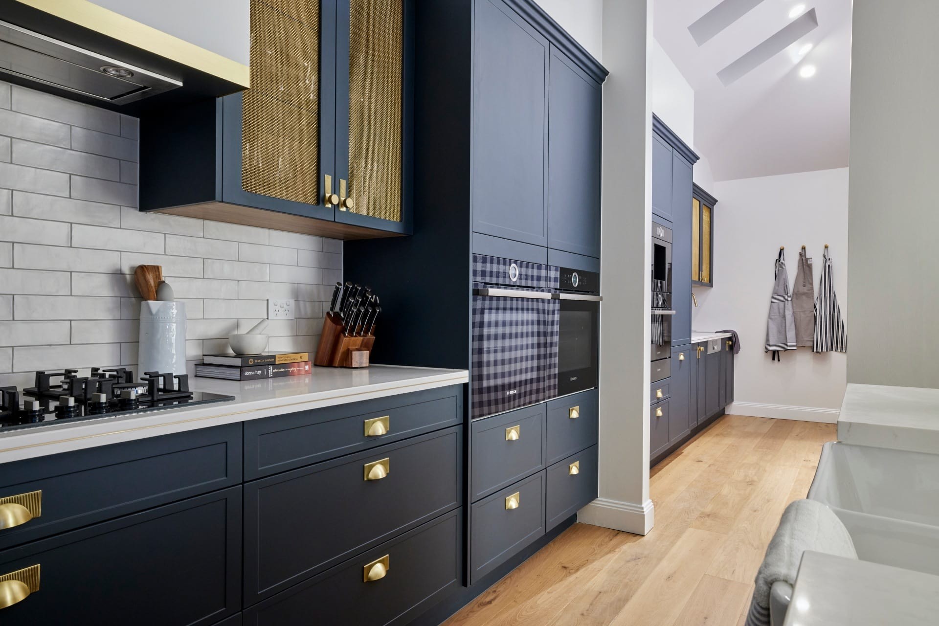 the block 2021 kirsty and jesse hamptons kitchen butlers pantry blue cabinets brass handles subway tiles