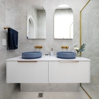 the block 2021 kirsty and jesse master ensuite white floating vanity with blue round basins and brass taps