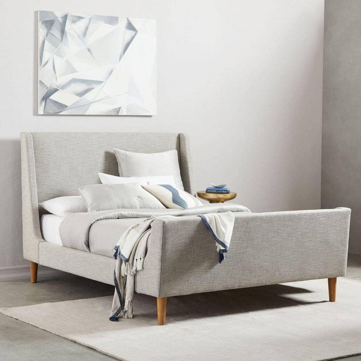 upholstered sleigh bed from west elm in light grey fabric