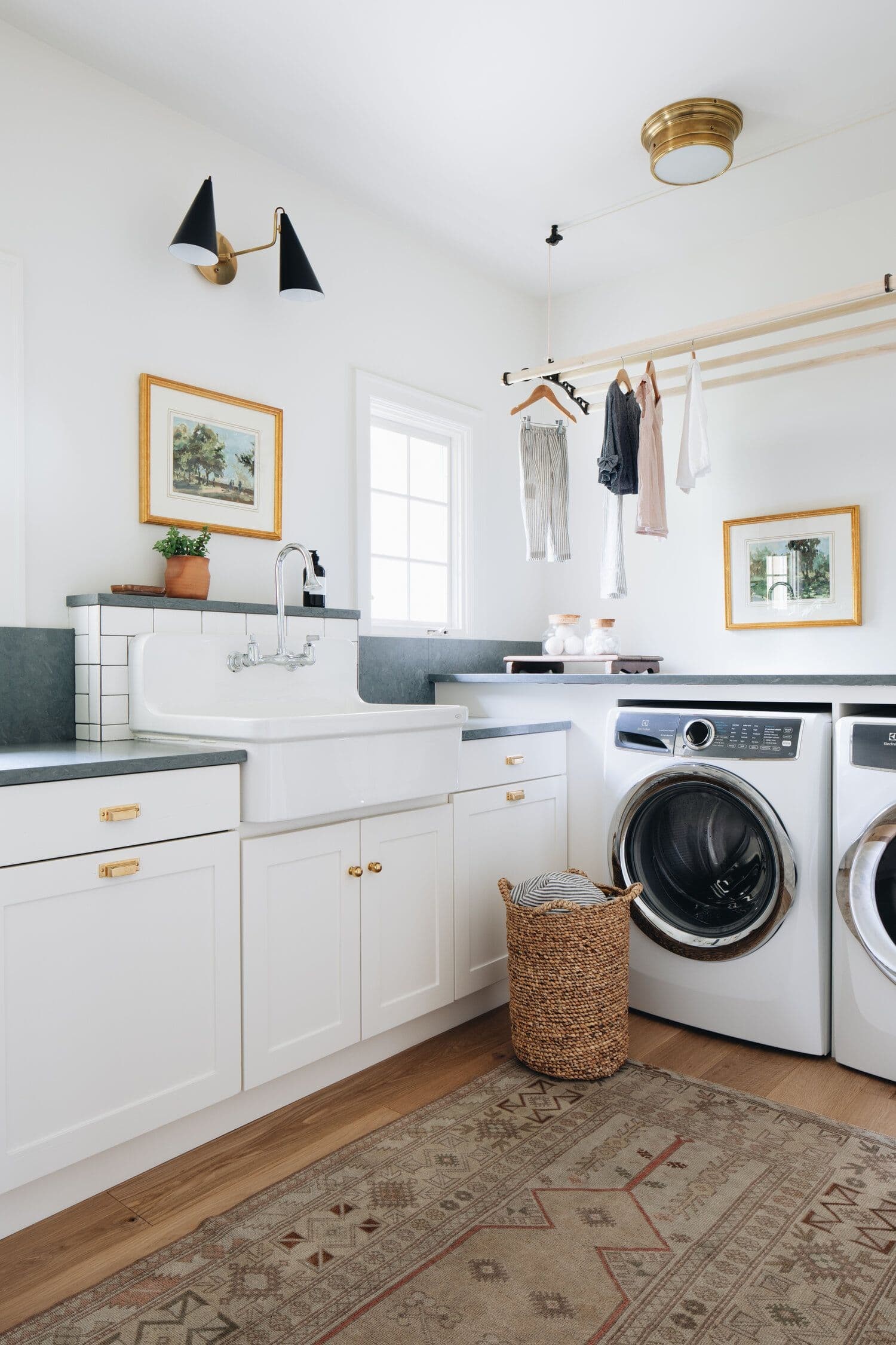 white and gold laundry room with moroccan floor rug