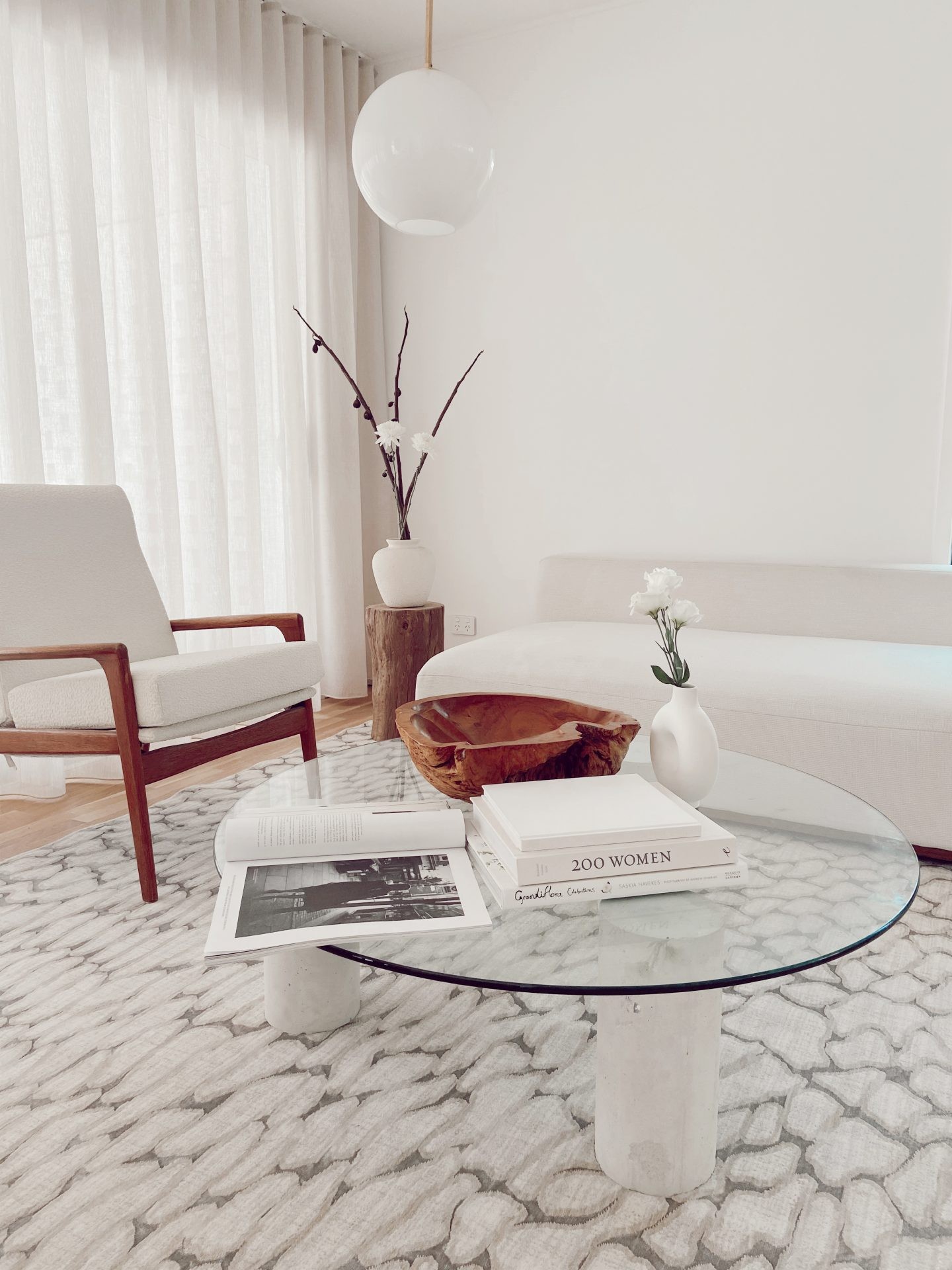 white mid century modern living room with patterned floor rug